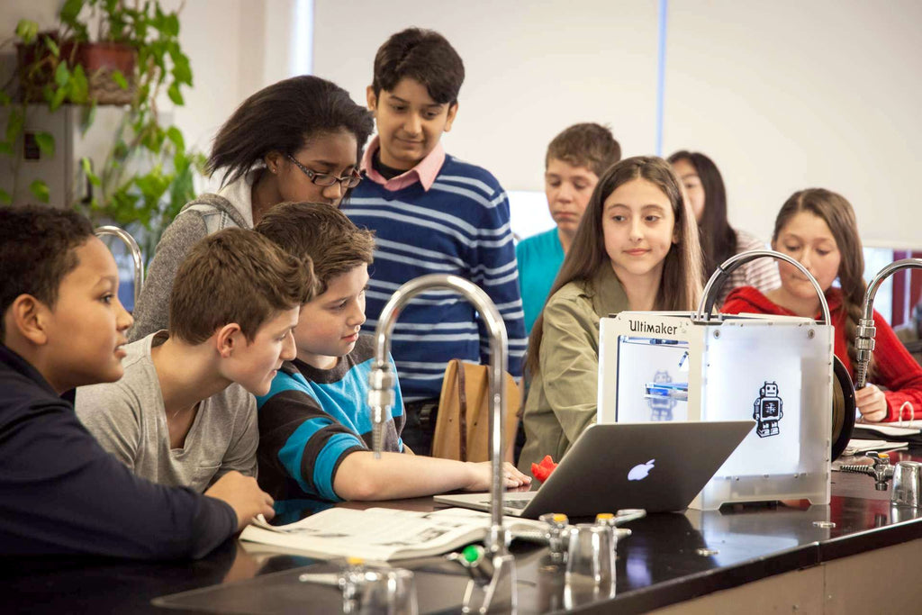 Students surrounding an Ultimaker 3D printer