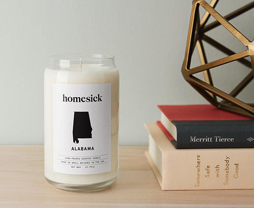 homesick candle on table