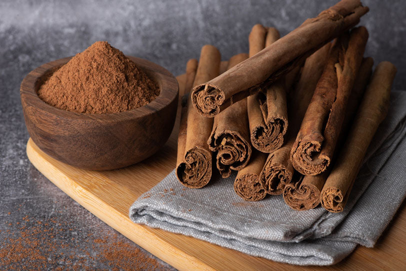 cinnamon sticks on wood