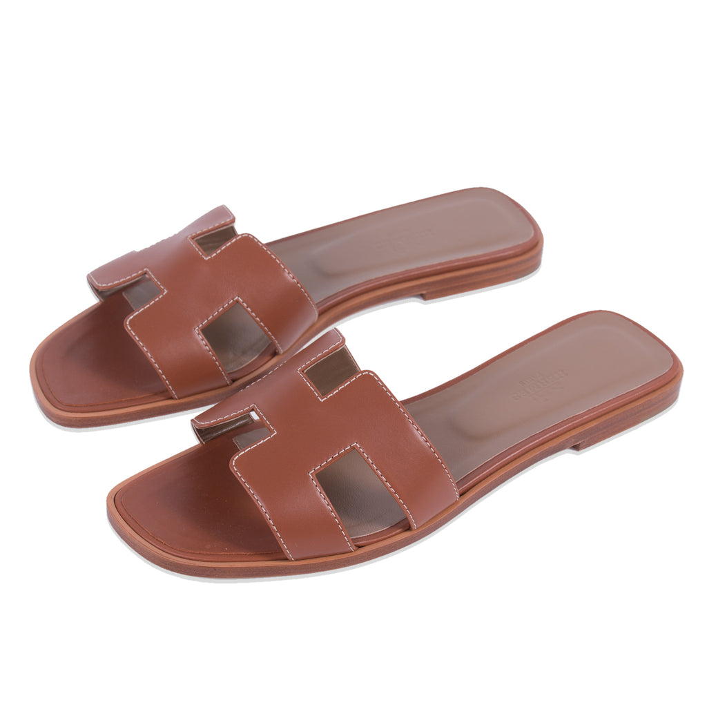 Shop authentic Herm s Oran Sandals  Gold at revogue for 