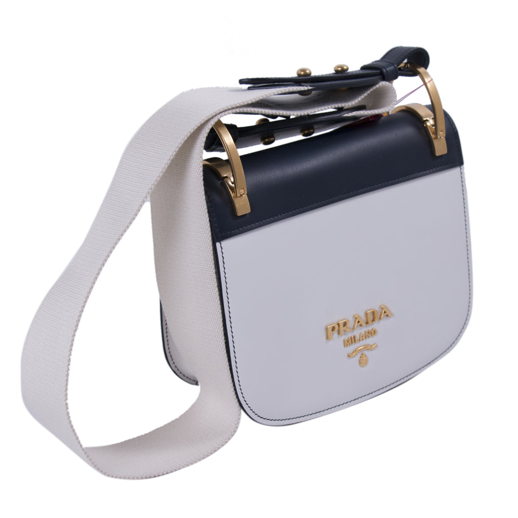 white prada saddle bag