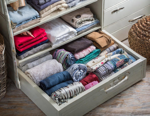 A well organized drawer filled with clothes