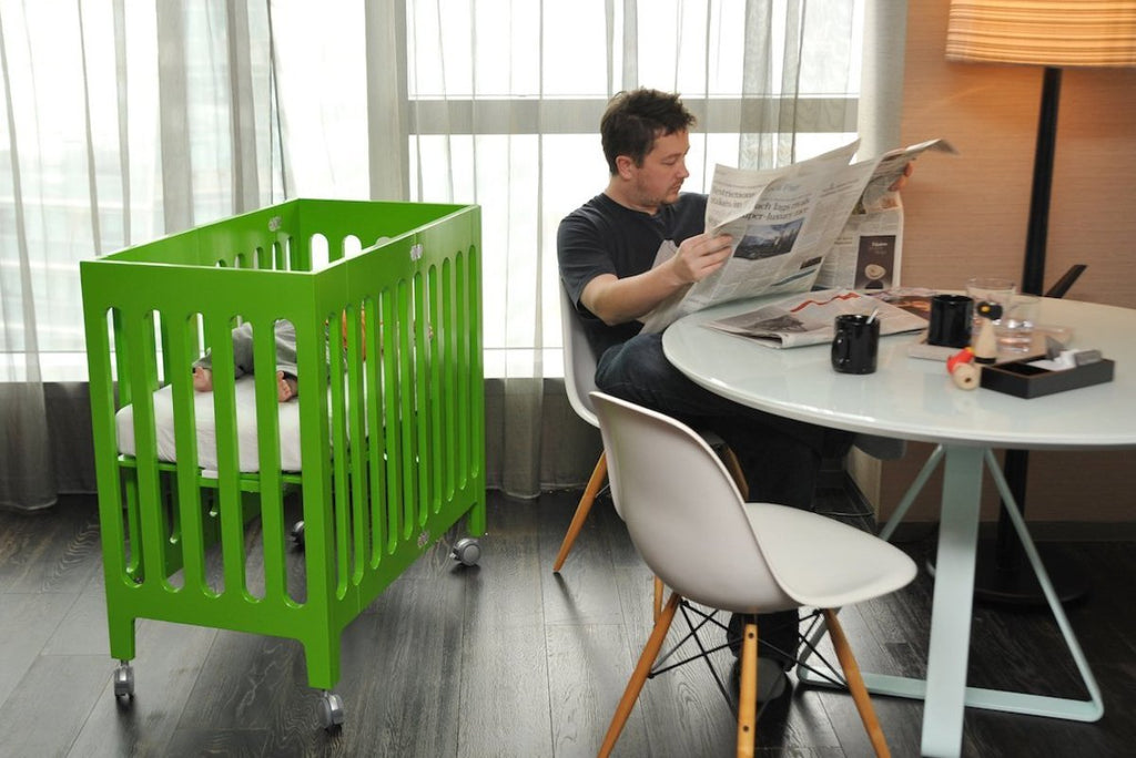 green mini crib