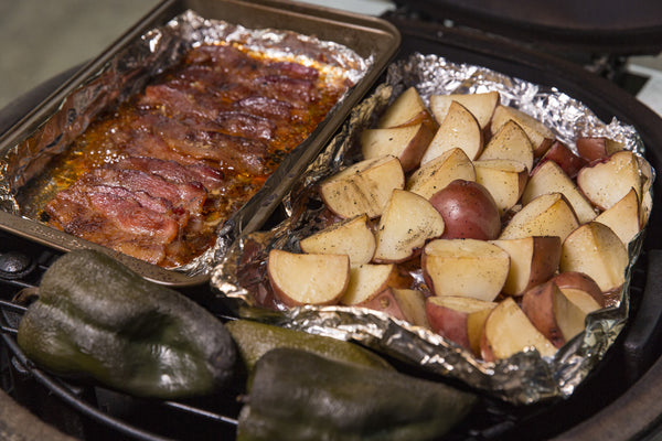 Hot Potato Salad: checking the bacon, peppers and potatoes that are over Fogo Natural Lump Charcoal