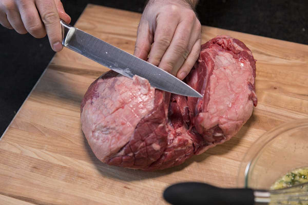 Trimming the fat off the Leg of Lamb