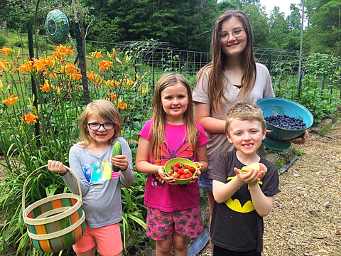 Children Standing in front of Cottagecore Garden