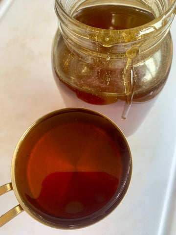 Fall honey in a jar and measuring cup