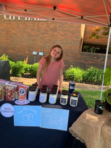 Girl selling handmade candles