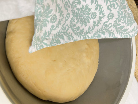 Bread Rising in Bowl Covered With Tea Towel