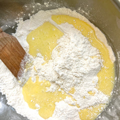 Mixing in wet ingredients to dry ingredients