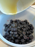 Adding honey to blueberry sauce