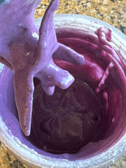 Blending the blueberry sauce and cream cheese in mixer