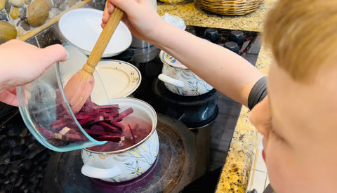 pouring beets into boiling water