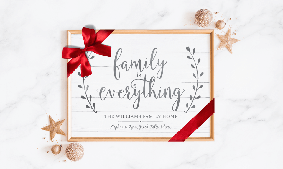 Family Is Everything Personalized Print wrapped in a red bow as a holiday gift