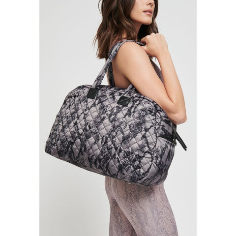 the Sol and Selene getaway weekender bag in a black snake fabric