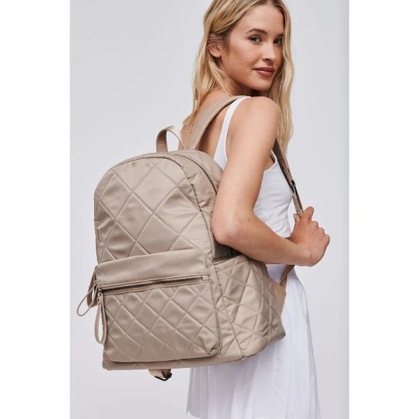 model wearing a large travel backpack