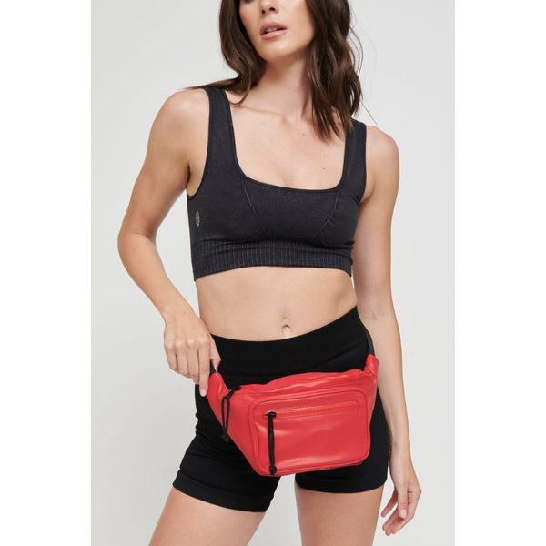 a model in black wearing a red belt bag