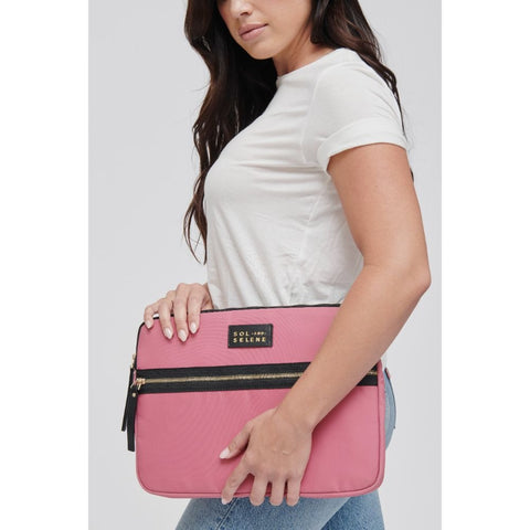 model holding a pink Sol and Selene laptop sleeve