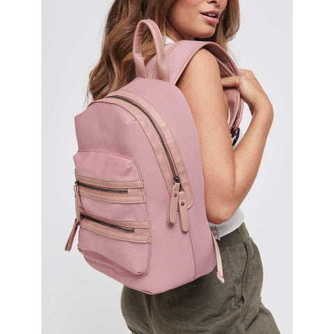 woman carrying a pink neoprene backpack