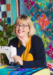 Anita at her quilting machine