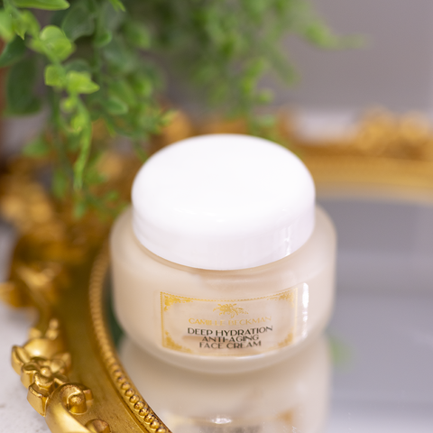 Camile Beckman Deep Hydration Anti-Aging Skin Cream product sitting on top of a round mirror