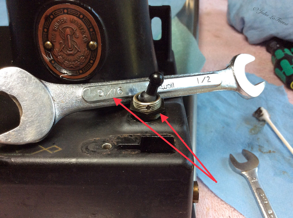 A 9/16" wrench was used to remove the retaining nut on the toggle switch