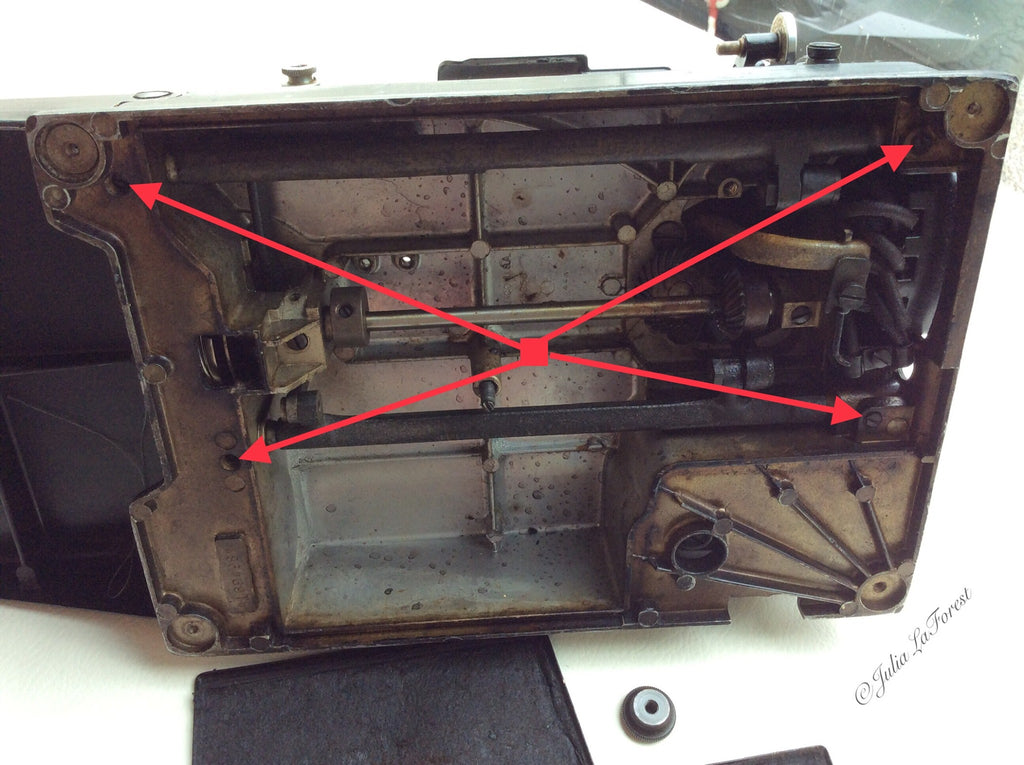 remove two set screws on the left side of the rocker arm shafts