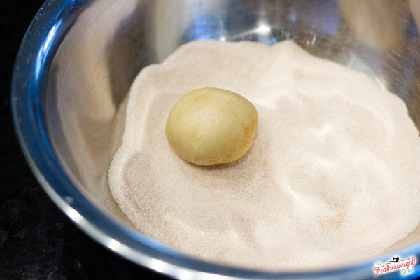 rolling the dough snickerdoodle cookies