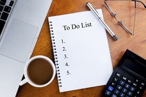 Replace your old paper to-do list with a dry erase version by using a re-stickable whiteboard on the surface of your desk