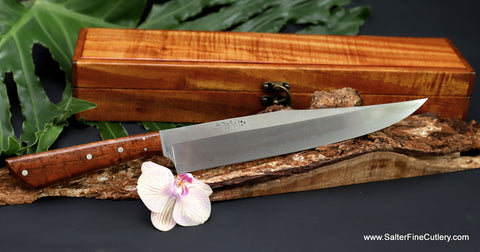 240mm Charybdis carving knife with polished finish and modern curly koa wood handle with keepsake box from Salter Fine Cutlery