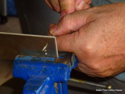 Beginning stages of making a decorative metal fitting for a knife