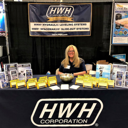 Photo courtesy of HWH Corporation. An HWH representative at the Winnebago Grand National Rally.