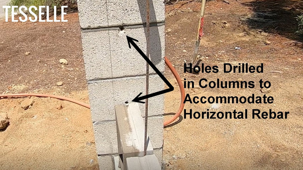 Holes drilled in masonry column to accommodate rebar