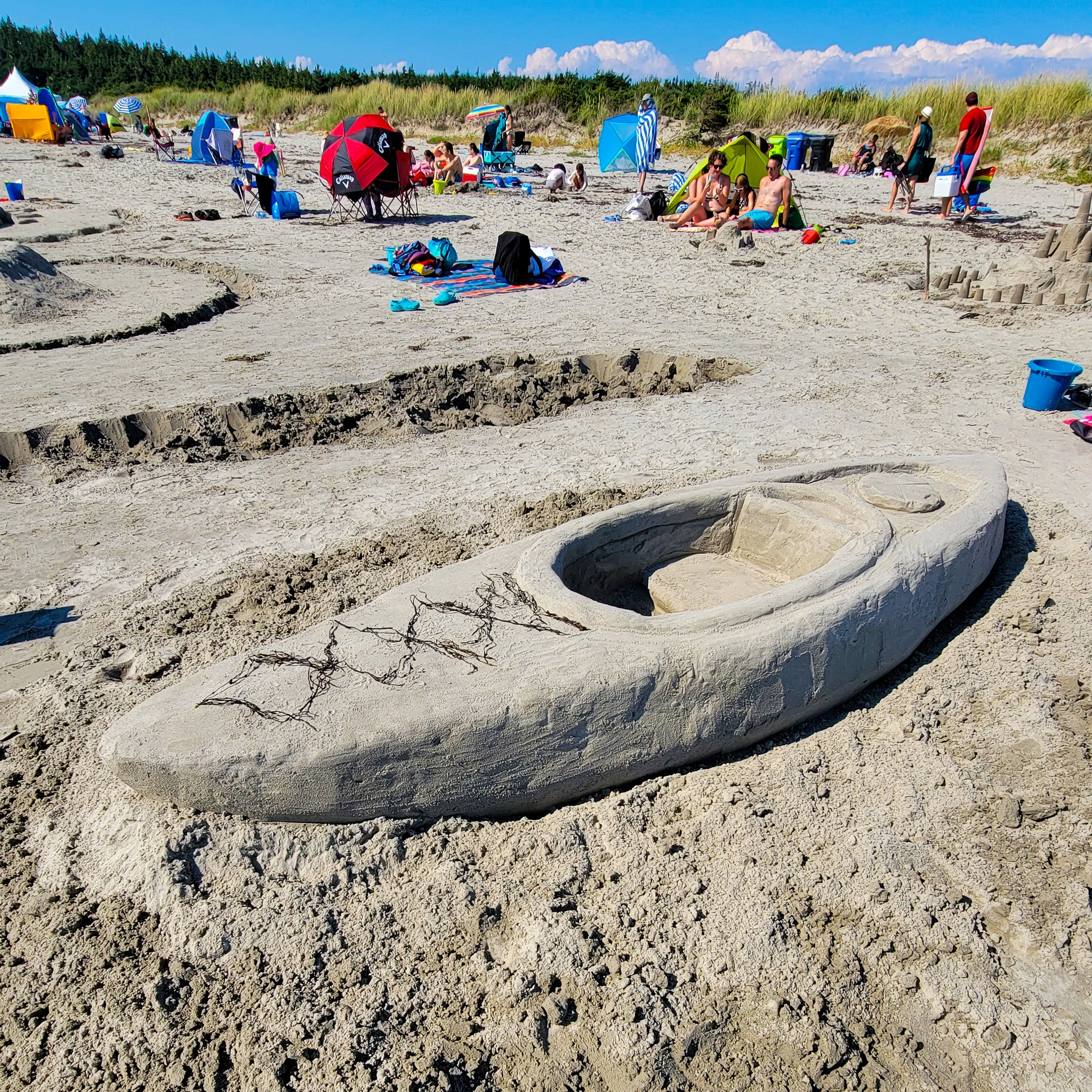 A kayak built completely out of beach sand. Life sized & ready for adventure.