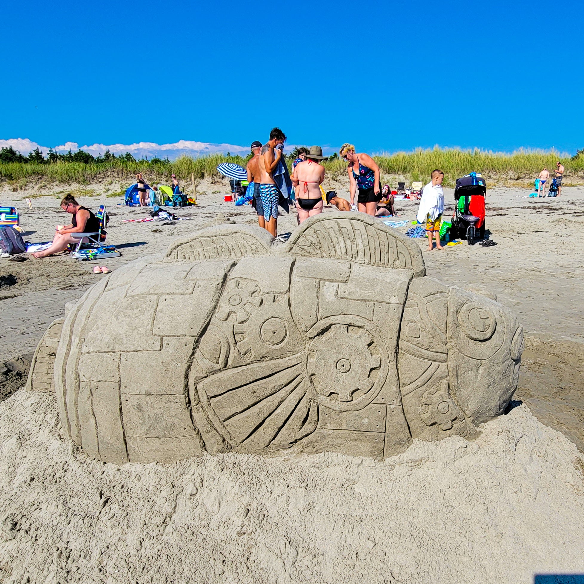 A beach sand sculpture of a big fish! #beachy #sandcastle #lifesized #art