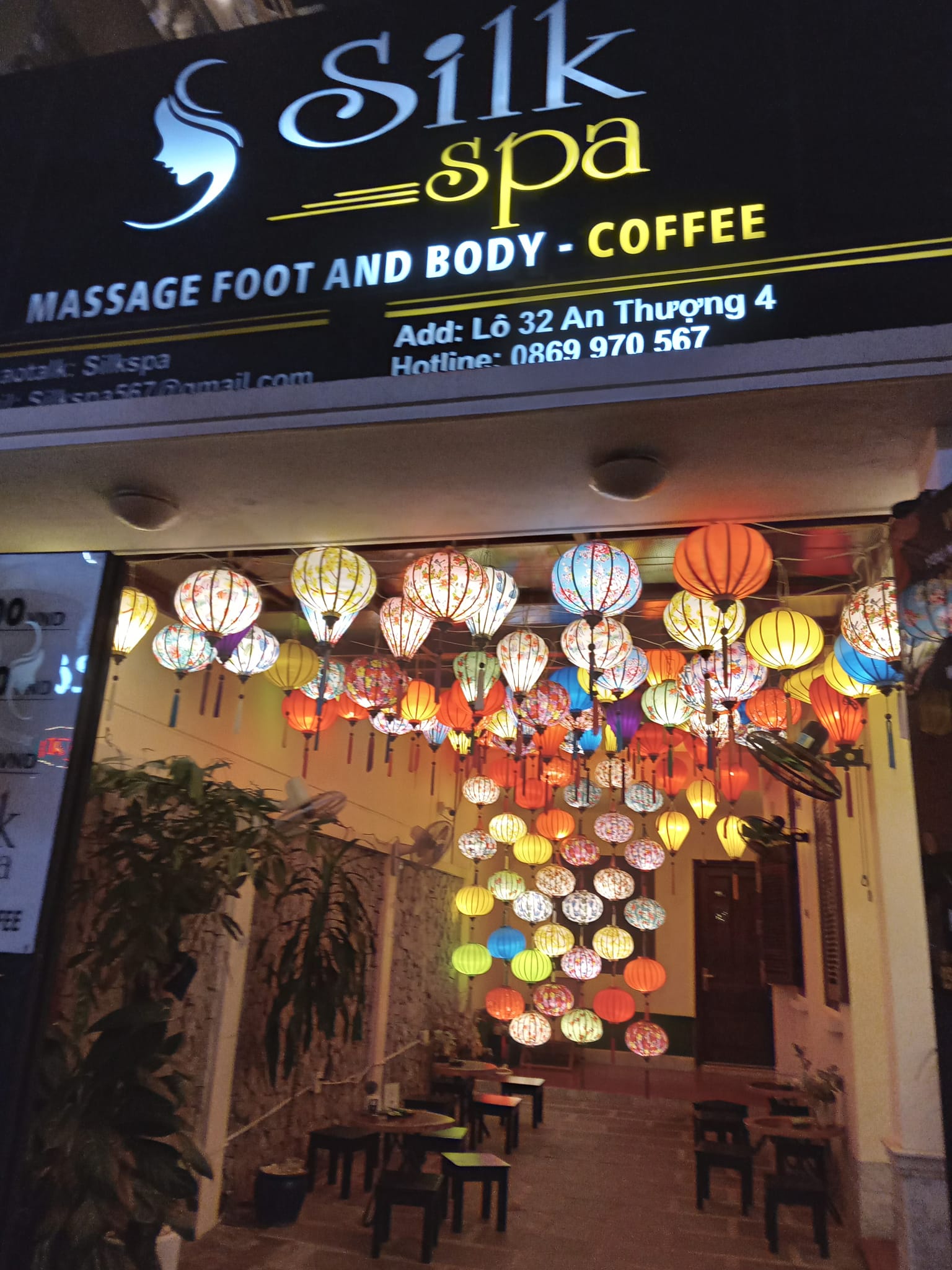 Massage storefront in Da Nang, Vietnam, with colourful lanterns hanging from the ceiling