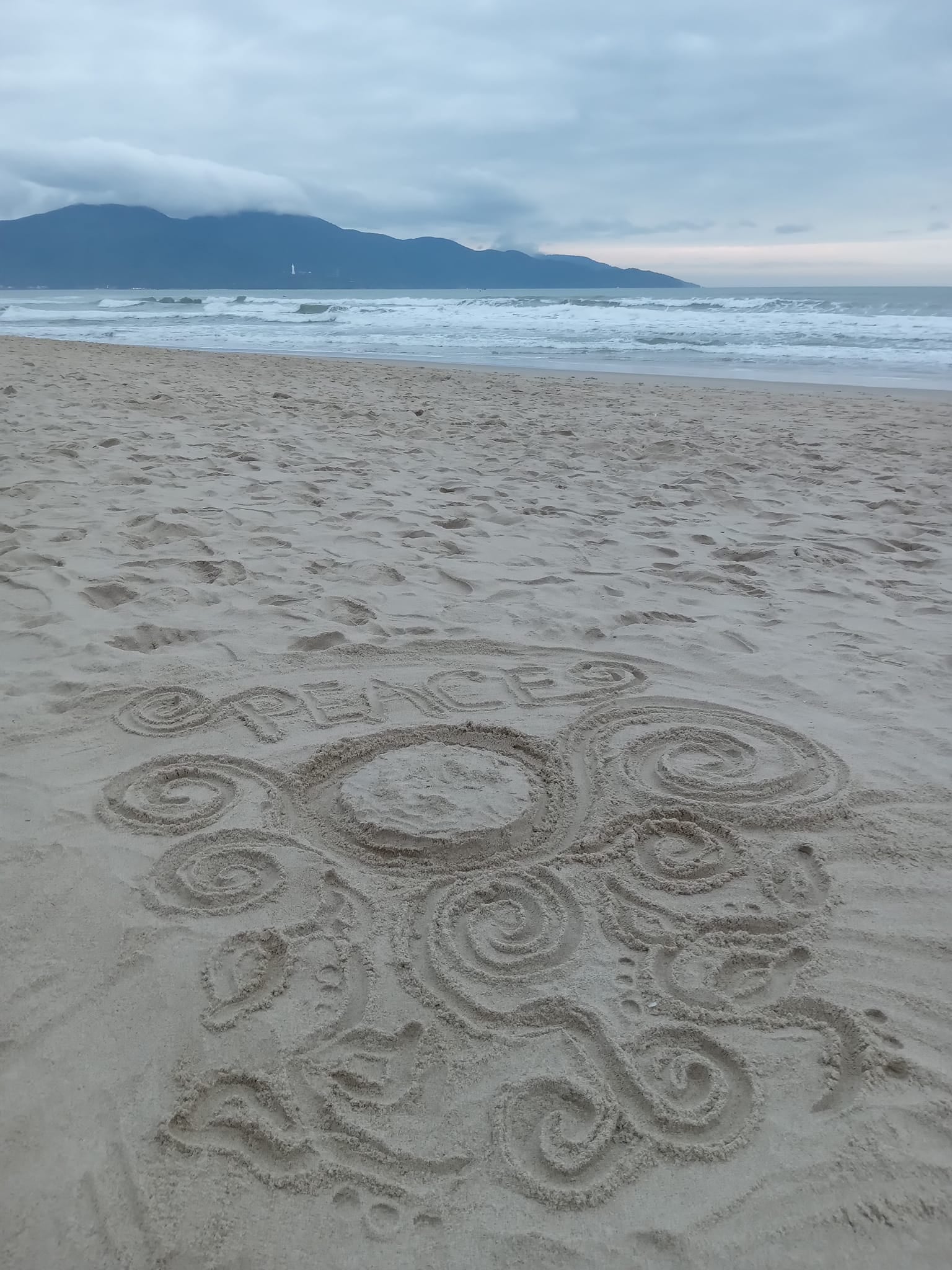 A sand doodle on the sand of Da Nang Beach in Vietnam