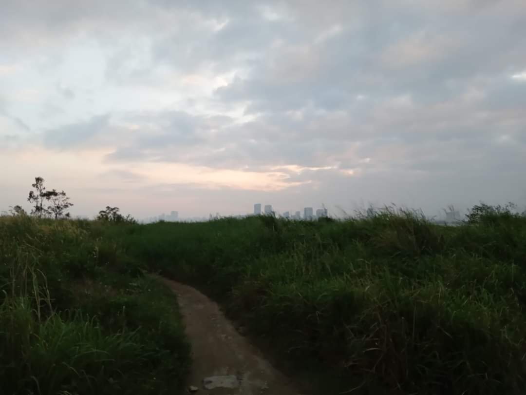 Dramatic skies with sun starting to set behind some thick clouds in Vietnam, Son Tra Mountains