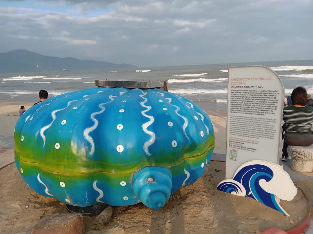 Giant blue painted seashell sculpture on the beach in Da Nang, Vietnam