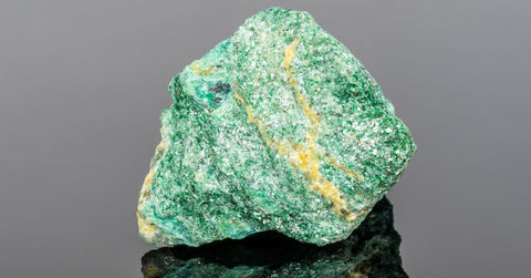 Fuchsite Mineral on Gray Background