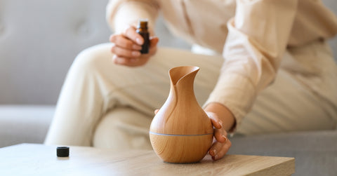 Hand Holding Essential Oil Diffuser