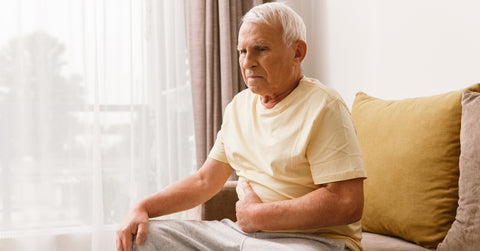Senior Man Is Suffering from Problems with Digestion