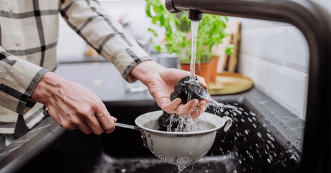 Woman Cleaning Shungite Stones