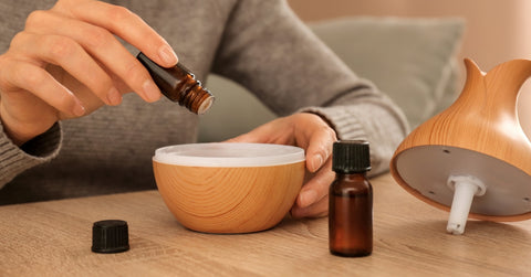 Woman Filling Essential Oil Diffuser