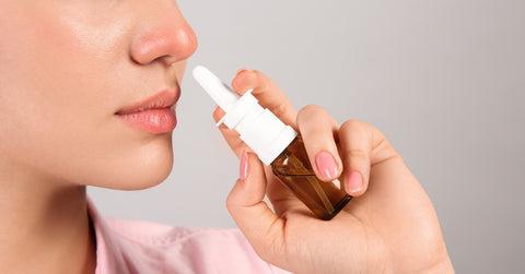 Woman Using Nasal Spray