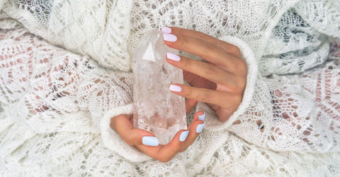 Woman holding clear quartz