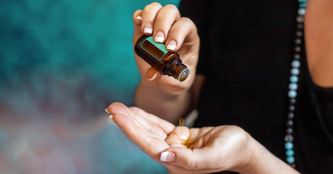 Womans hand with essential oil