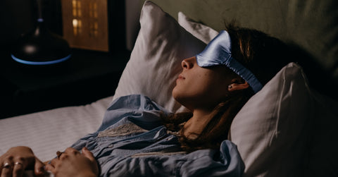 asleep woman wearing eye mask
