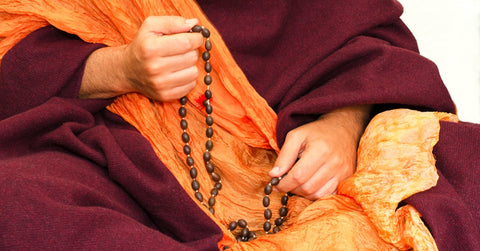 buddhist monk with mala beads