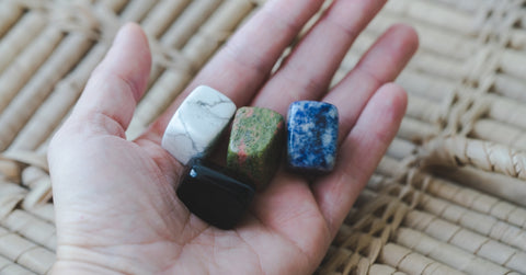 hand holding healing crystals